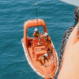 OJ Safety delivering full LSA service for lifeboats, rescue boats, FRB and davit systems under SOLAS III and IMO MSC.402(96) across all major European ports. Technicians performing on-load release tests, hook overhaul, winch and brake checks, fall wire inspection, dynamic lowering and recovery for class approval.